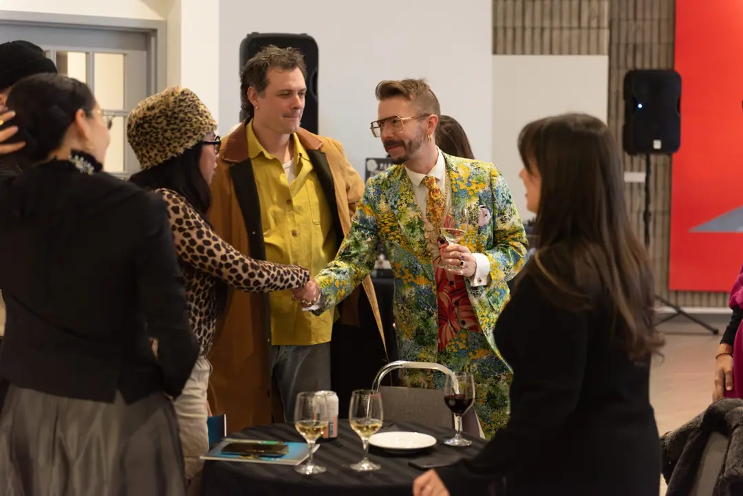 Guests chatting at an evening reception at the Art Gallery of Burlington