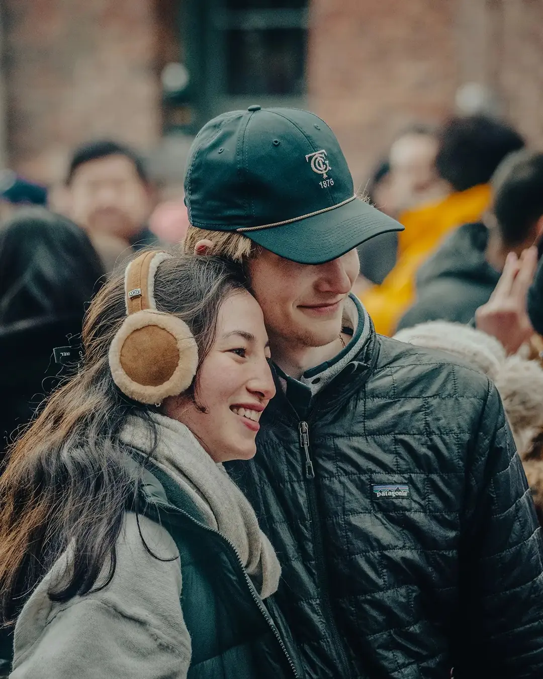 A couple bundled up in winter coats at the Distillery Winter Village